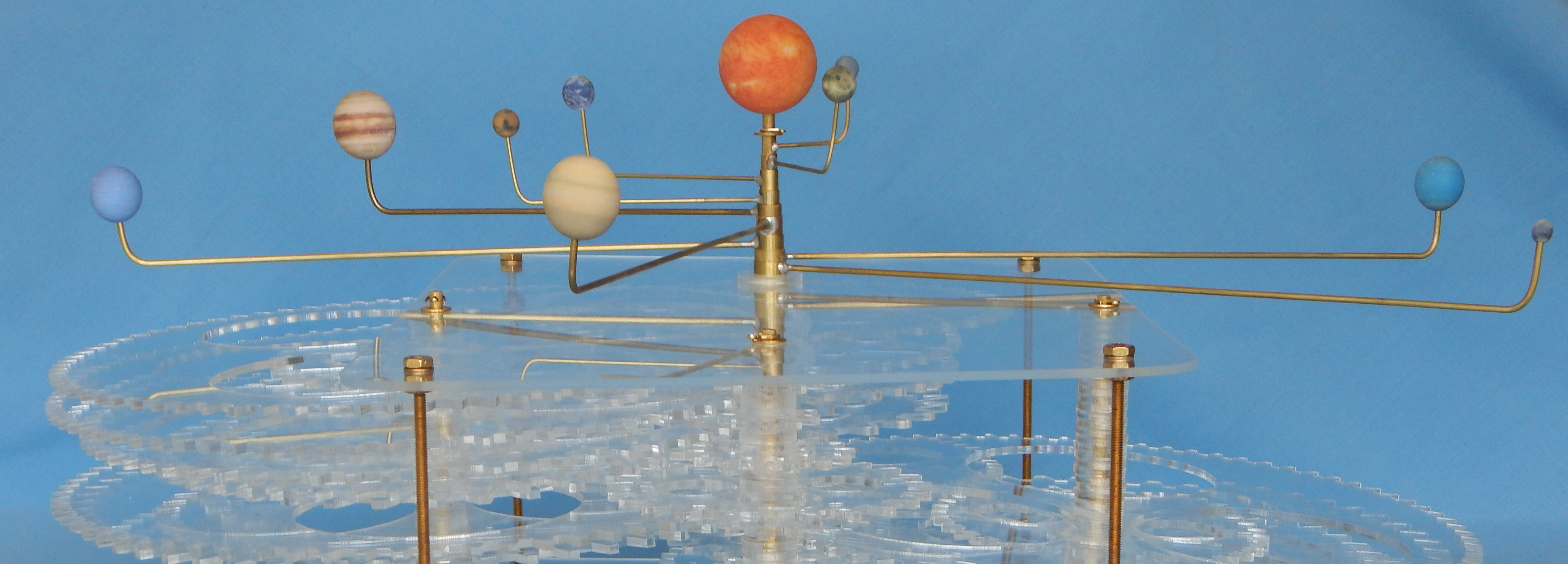 Color photograph of my orrery showing planets, arms, and some of gearbox.